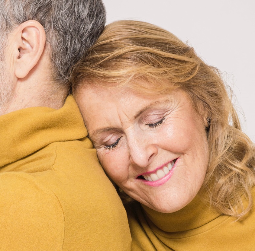 Woman sighing with relief with her partner